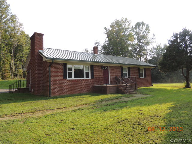 580 Guinea Road Farmville, VA 23901 - Photo 1 of 16 a view of a house with a yard and sitting area