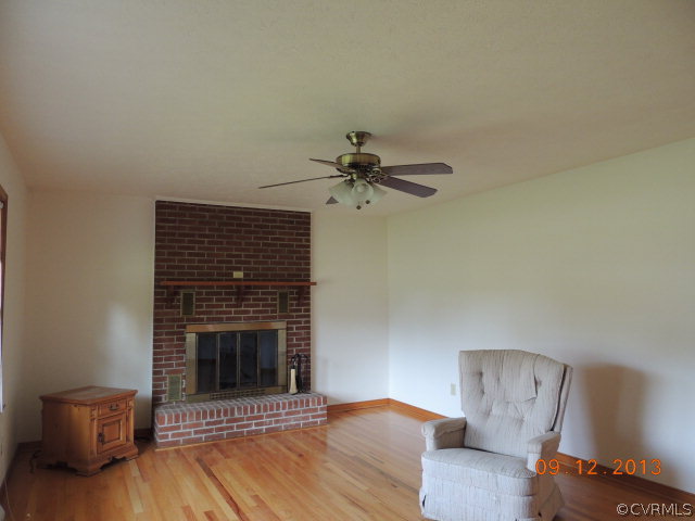 580 Guinea Road Farmville, VA 23901 - Photo 10 of 16 a living room with furniture and a fireplace