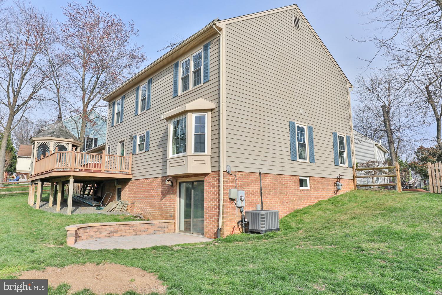 5423 Rilian Court Burke, VA 22015 - Photo 8 of 67 a front view of a house with a yard