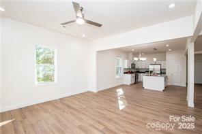 115 West Lacy Street Chester, SC 29706 - Photo 11 of 47 a view of kitchen with kitchen island stainless steel appliances refrigerator stove microwave and cabinets