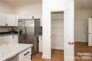 115 West Lacy Street Chester, SC 29706 - Photo 12 of 47 a kitchen with a refrigerator and countertop