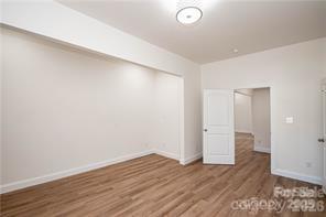 115 West Lacy Street Chester, SC 29706 - Photo 16 of 47 a view of an empty room with wooden floor and closet