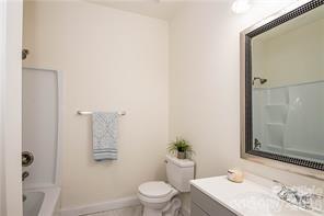 115 West Lacy Street Chester, SC 29706 - Photo 19 of 47 a bathroom with a granite countertop sink and a mirror