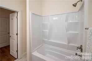 115 West Lacy Street Chester, SC 29706 - Photo 20 of 47 a bathroom with a bathtub and a shower