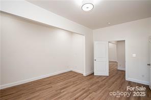 115 West Lacy Street Chester, SC 29706 - Photo 21 of 47 a view of an empty room with wooden floor and closet