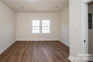 115 West Lacy Street Chester, SC 29706 - Photo 24 of 47 an empty room with wooden floor and windows