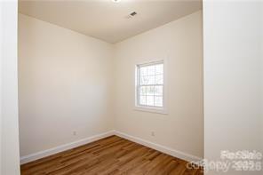115 West Lacy Street Chester, SC 29706 - Photo 28 of 47 a view of an empty room with wooden floor and a window