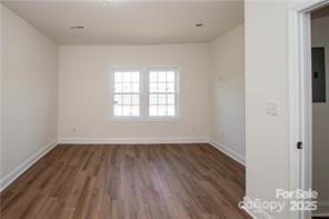 115 West Lacy Street Chester, SC 29706 - Photo 29 of 47 an empty room with wooden floor and windows