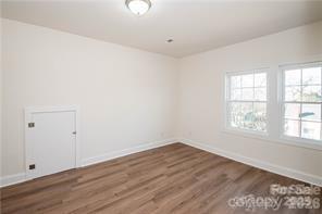 115 West Lacy Street Chester, SC 29706 - Photo 32 of 47 an empty room with wooden floor and windows