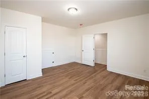 an empty room with wooden floor
