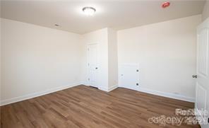 115 West Lacy Street Chester, SC 29706 - Photo 35 of 47 an empty room with wooden floor