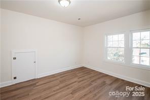 115 West Lacy Street Chester, SC 29706 - Photo 37 of 47 an empty room with wooden floor and windows