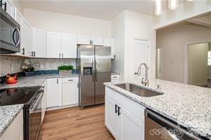 115 West Lacy Street Chester, SC 29706 - Photo 4 of 47 a kitchen with stainless steel appliances granite countertop a sink stove and refrigerator