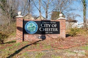 115 West Lacy Street Chester, SC 29706 - Photo 46 of 47 a sign broad on a brick wall