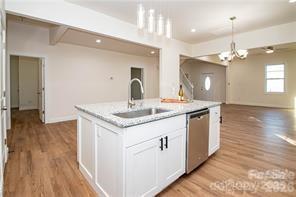 115 West Lacy Street Chester, SC 29706 - Photo 6 of 47 a kitchen with a sink and chandelier