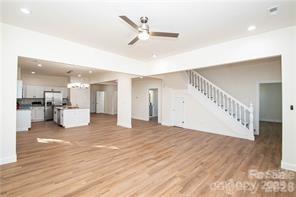 115 West Lacy Street Chester, SC 29706 - Photo 8 of 47 a view of an empty room with wooden floor