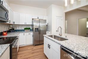 115 West Lacy Street Chester, SC 29706 - Photo 8 of 47 a kitchen with stainless steel appliances granite countertop a sink stove and refrigerator