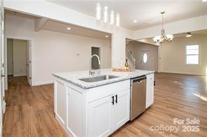 115 West Lacy Street Chester, SC 29706 - Photo 10 of 47 a kitchen with a sink and chandelier