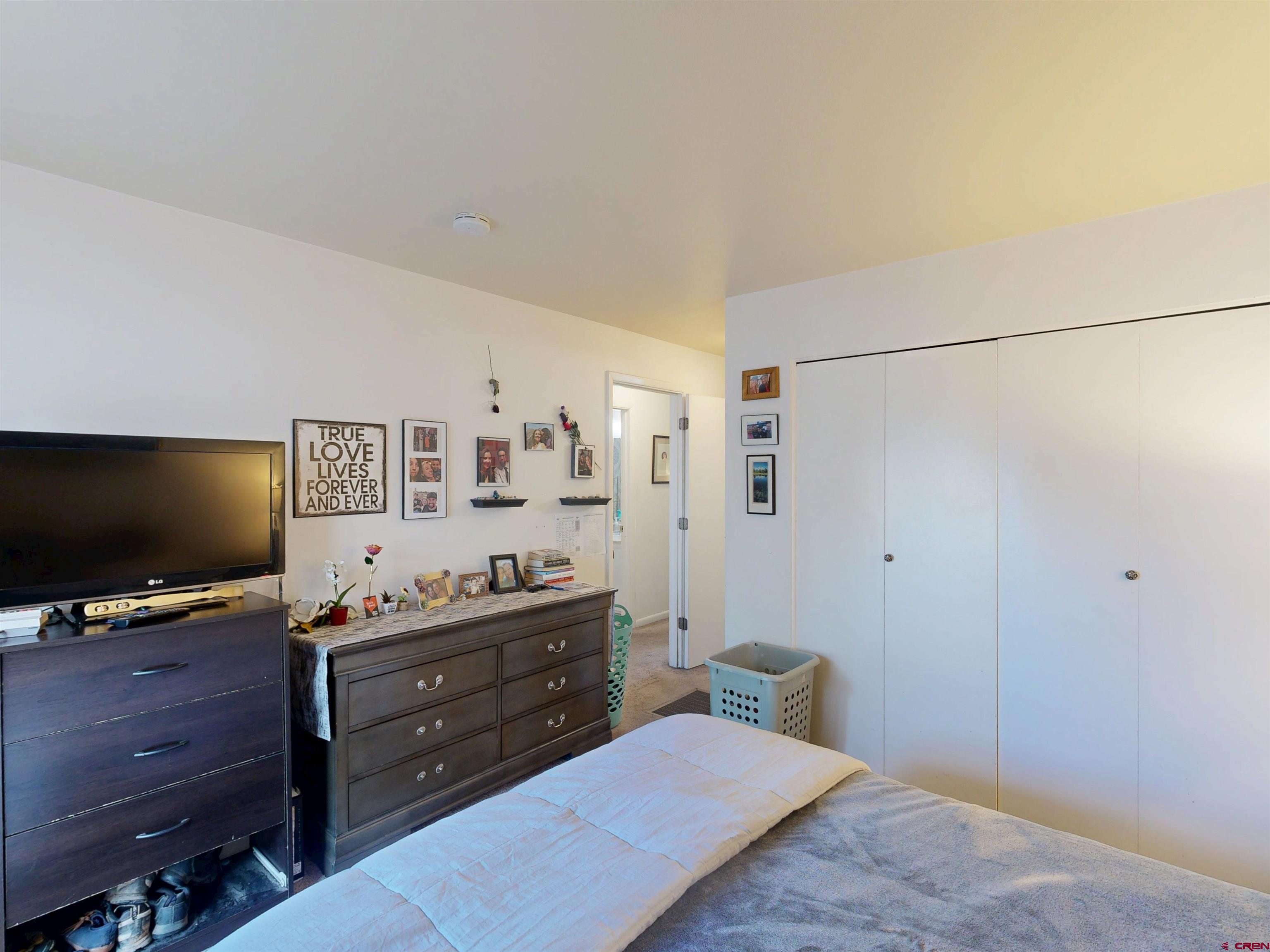 1200 Florida Road, Unit 17 Durango, CO 81301 - Photo 11 of 23 a bedroom with a bed and wooden floor