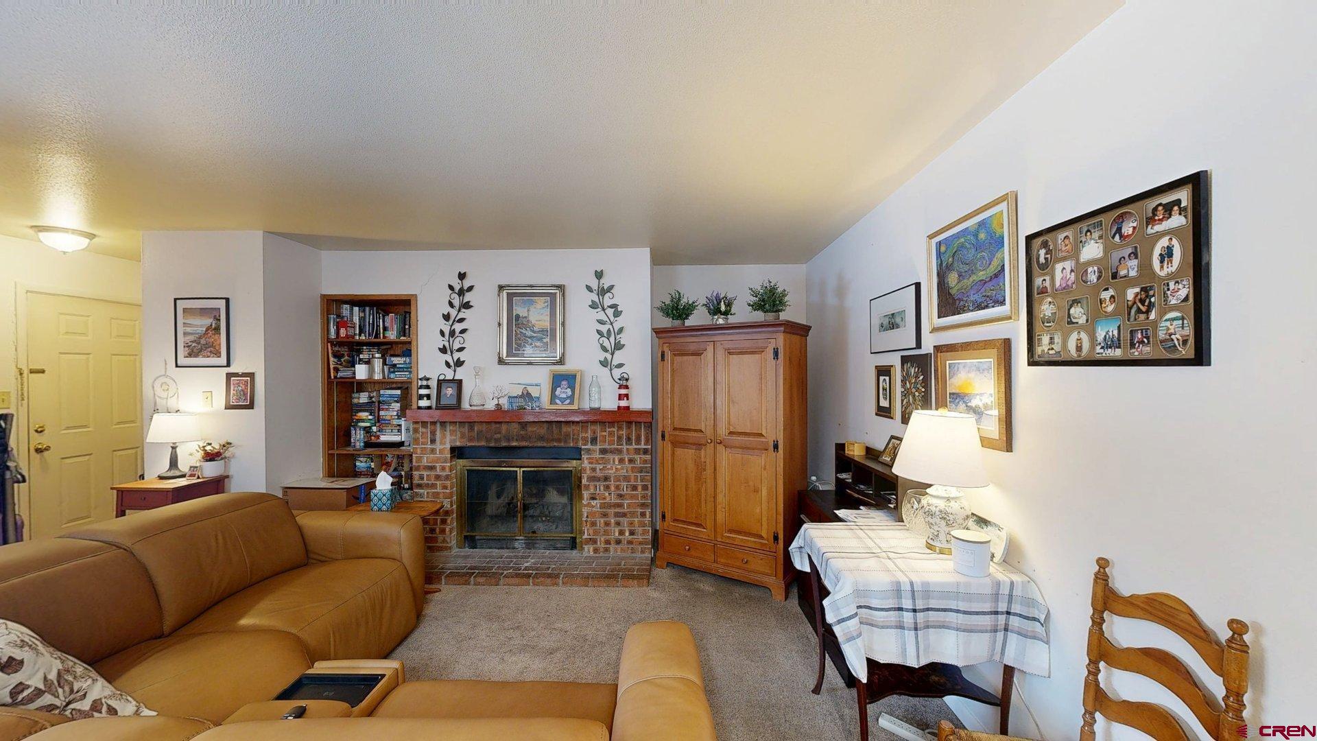 1200 Florida Road, Unit 17 Durango, CO 81301 - Photo 2 of 23 a living room with furniture and a flat screen tv