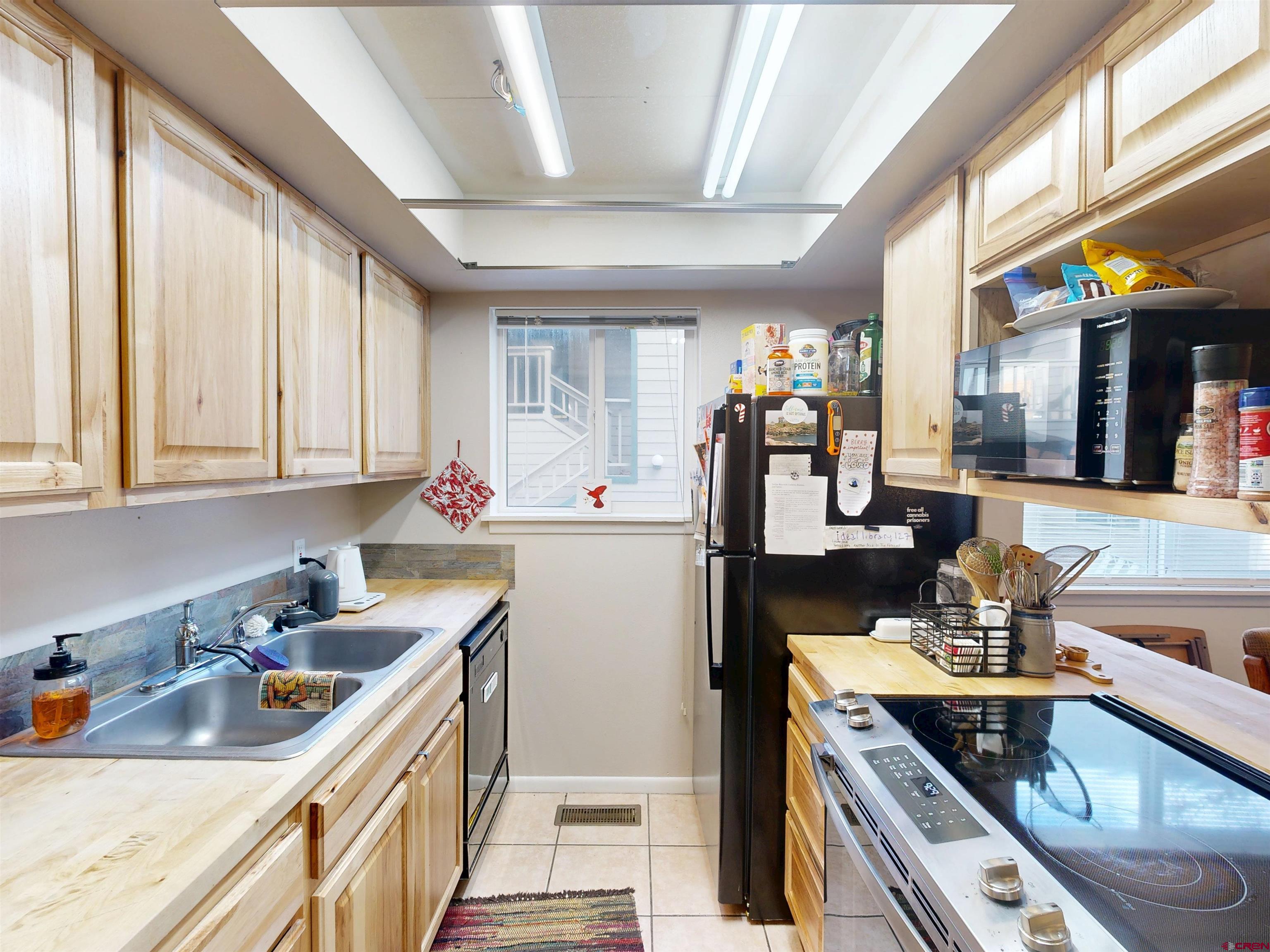1200 Florida Road, Unit 17 Durango, CO 81301 - Photo 8 of 23 a kitchen with stainless steel appliances granite countertop a sink stove and cabinets
