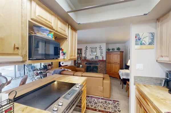 a kitchen with a sink and a stove top oven