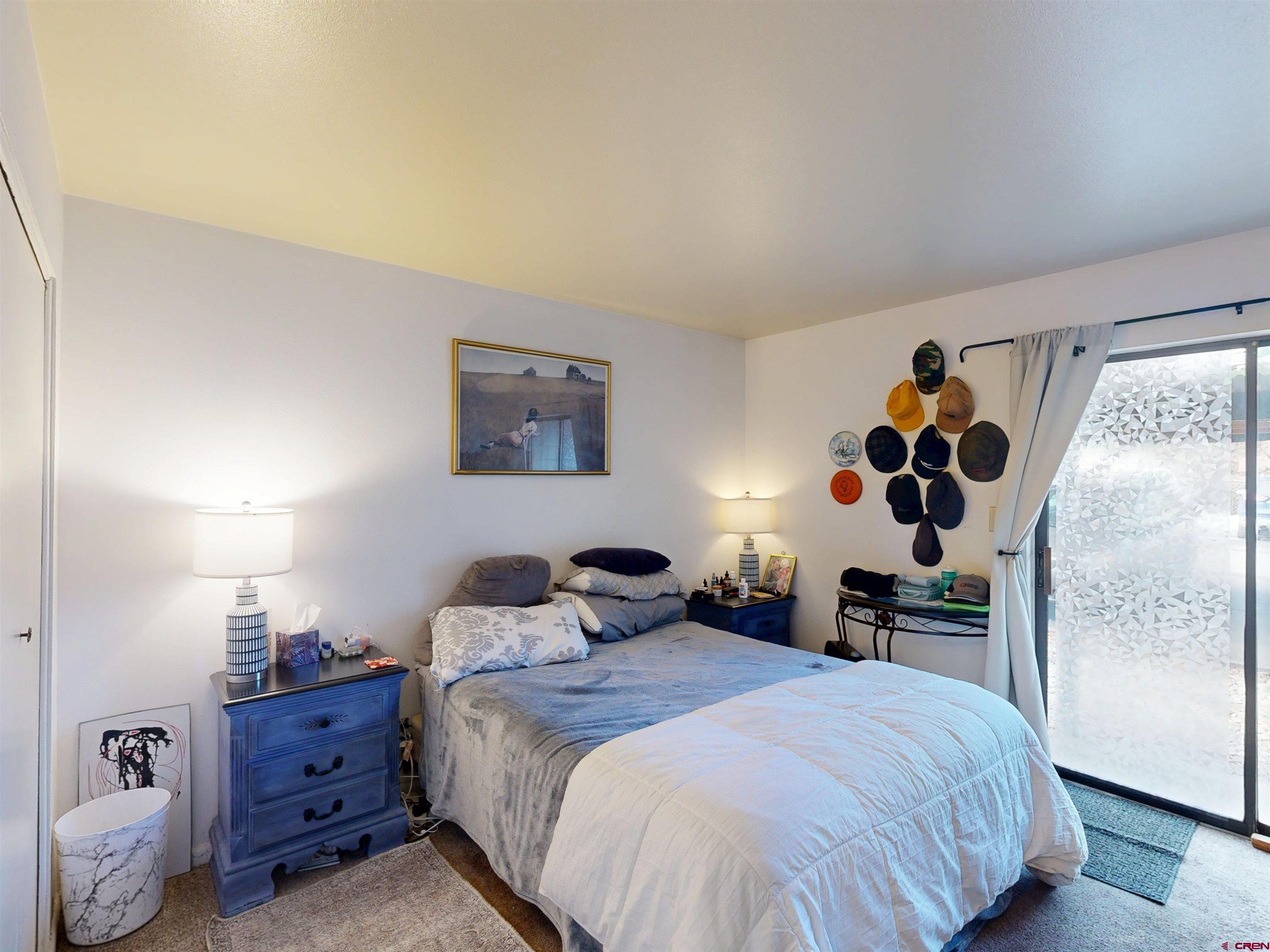 1200 Florida Road, Unit 17 Durango, CO 81301 - Photo 10 of 23 a bedroom with a bed and wooden floor