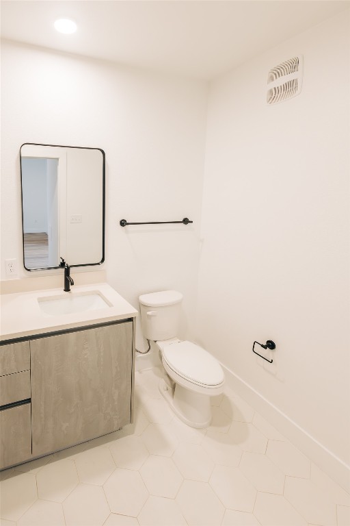 4315 South Congress Avenue, Unit 406 Austin, TX 78745 - Photo 11 of 19 a bathroom with a sink a toilet and mirror