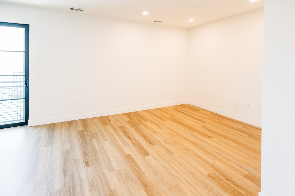 4315 South Congress Avenue, Unit 406 Austin, TX 78745 - Photo 9 of 19 a view of empty room with wooden floor