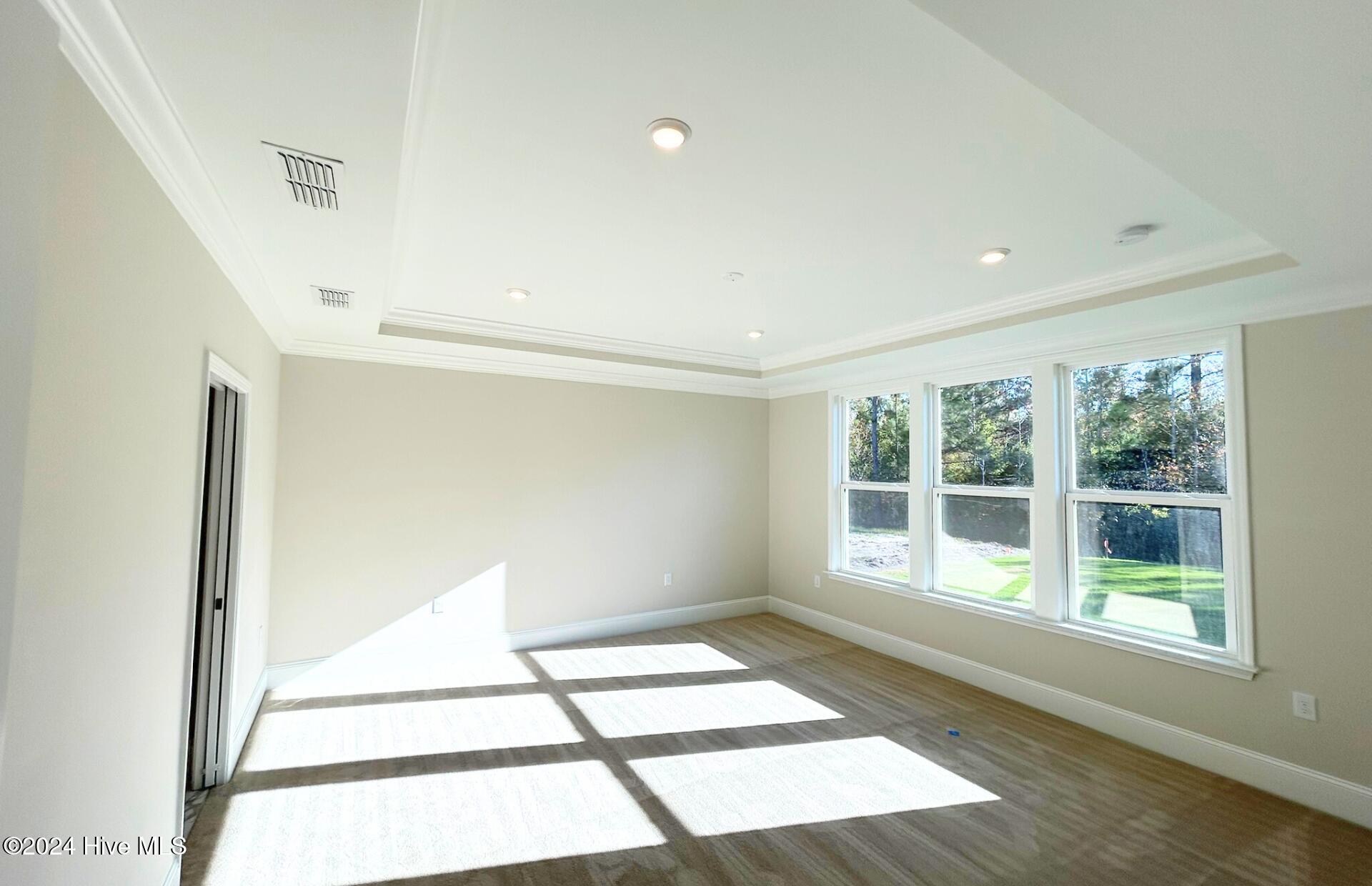 7523 Gorse Drive, Unit 38 Leland, NC 28479 - Photo 13 of 52 Spacious Primary Bedroom with Tray Ceiling