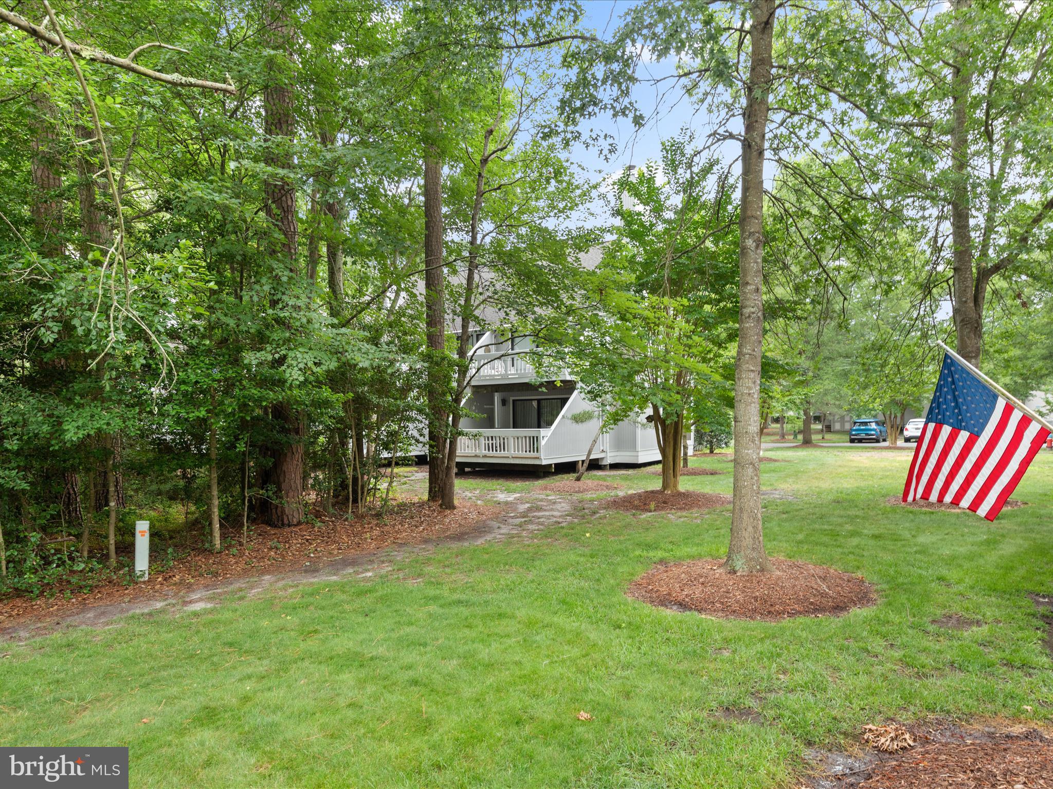 39346 Racquet Lane, Unit 8504 Bethany Beach, DE 19930 - Photo 33 of 40 a front view of a house with a yard