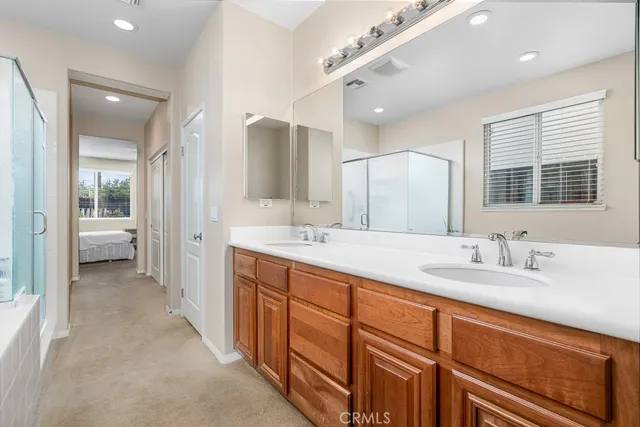 a bathroom with bathtub and a shower