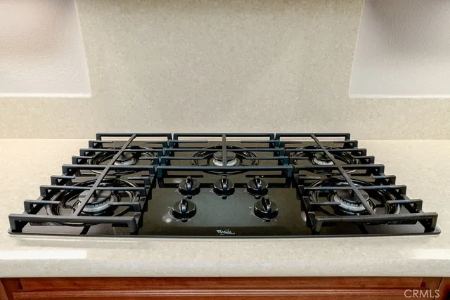 a kitchen with stainless steel appliances a refrigerator a stove and a refrigerator