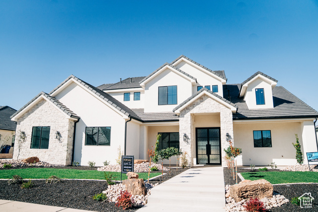 2775 Rowan Lane St. George, UT 84790 - Photo 1 of 1 View of front of property with stone siding, a tiled roof, and stucco siding