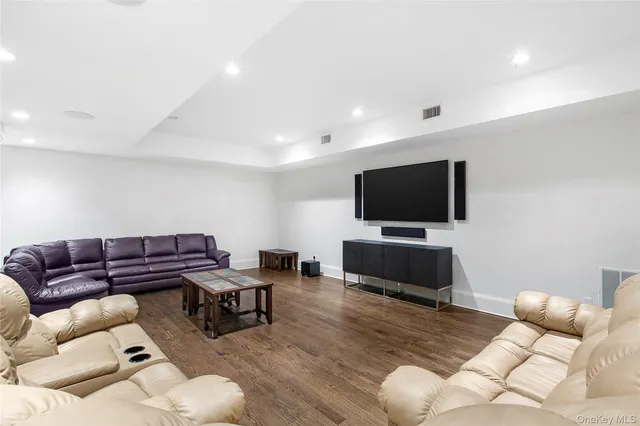 a front view of a house with swimming pool and outdoor seating