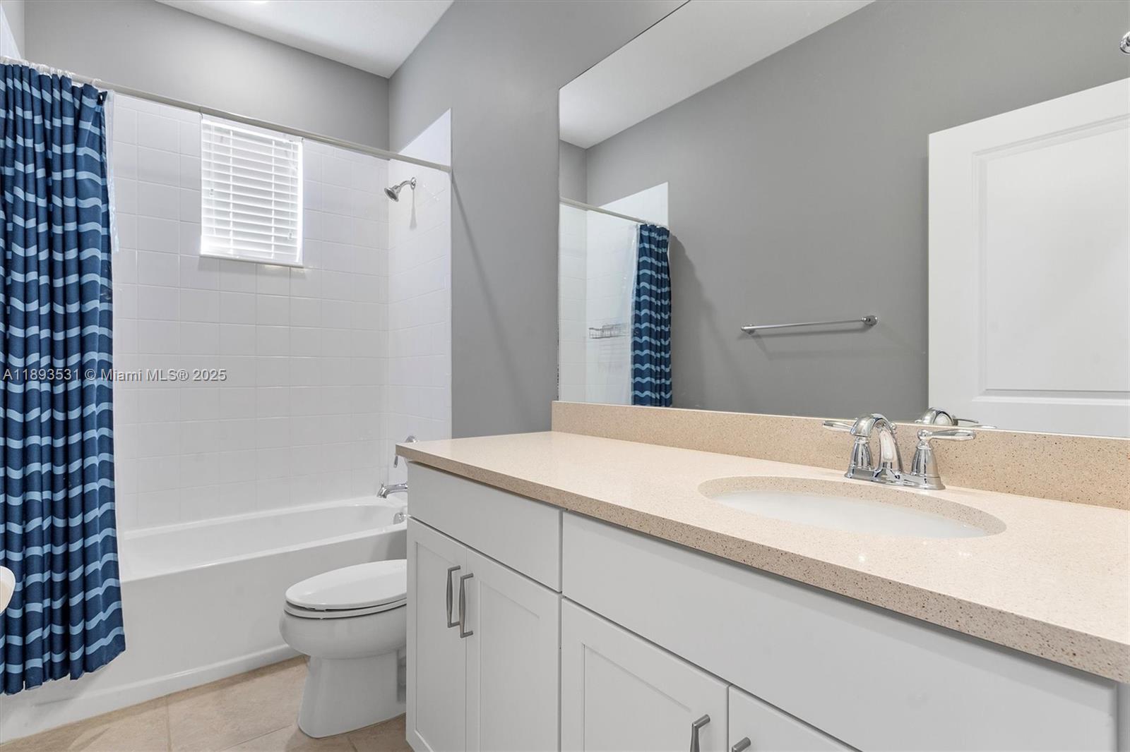 1240 Eucalyptus Drive, Unit 1 Hollywood, FL 33021 - Photo 12 of 20 a bathroom with a sink a toilet and shower