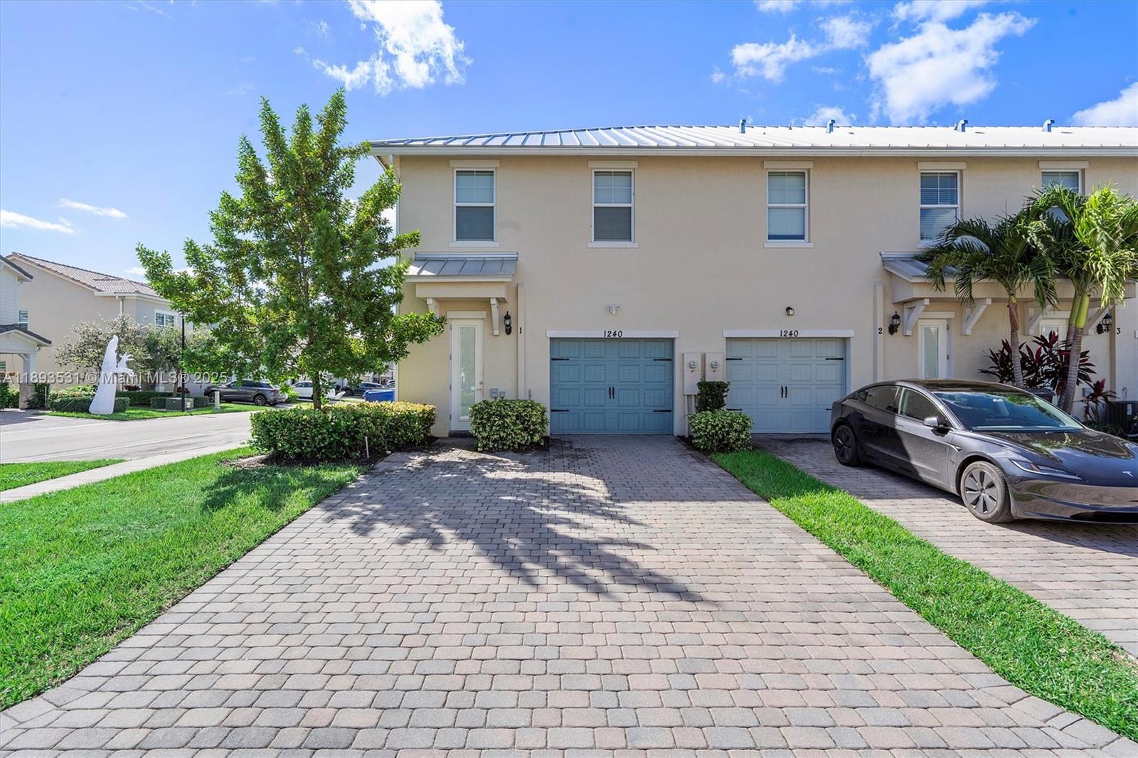1240 Eucalyptus Drive, Unit 1 Hollywood, FL 33021 - Photo 13 of 20 a car parked in front of a white house