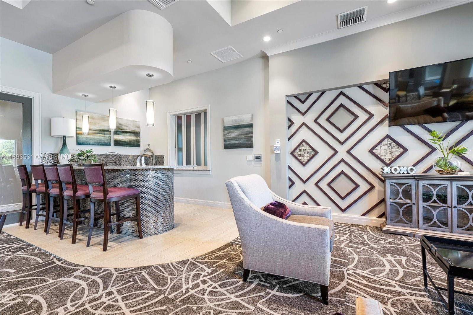 1240 Eucalyptus Drive, Unit 1 Hollywood, FL 33021 - Photo 17 of 20 a living room with furniture and a flat screen tv