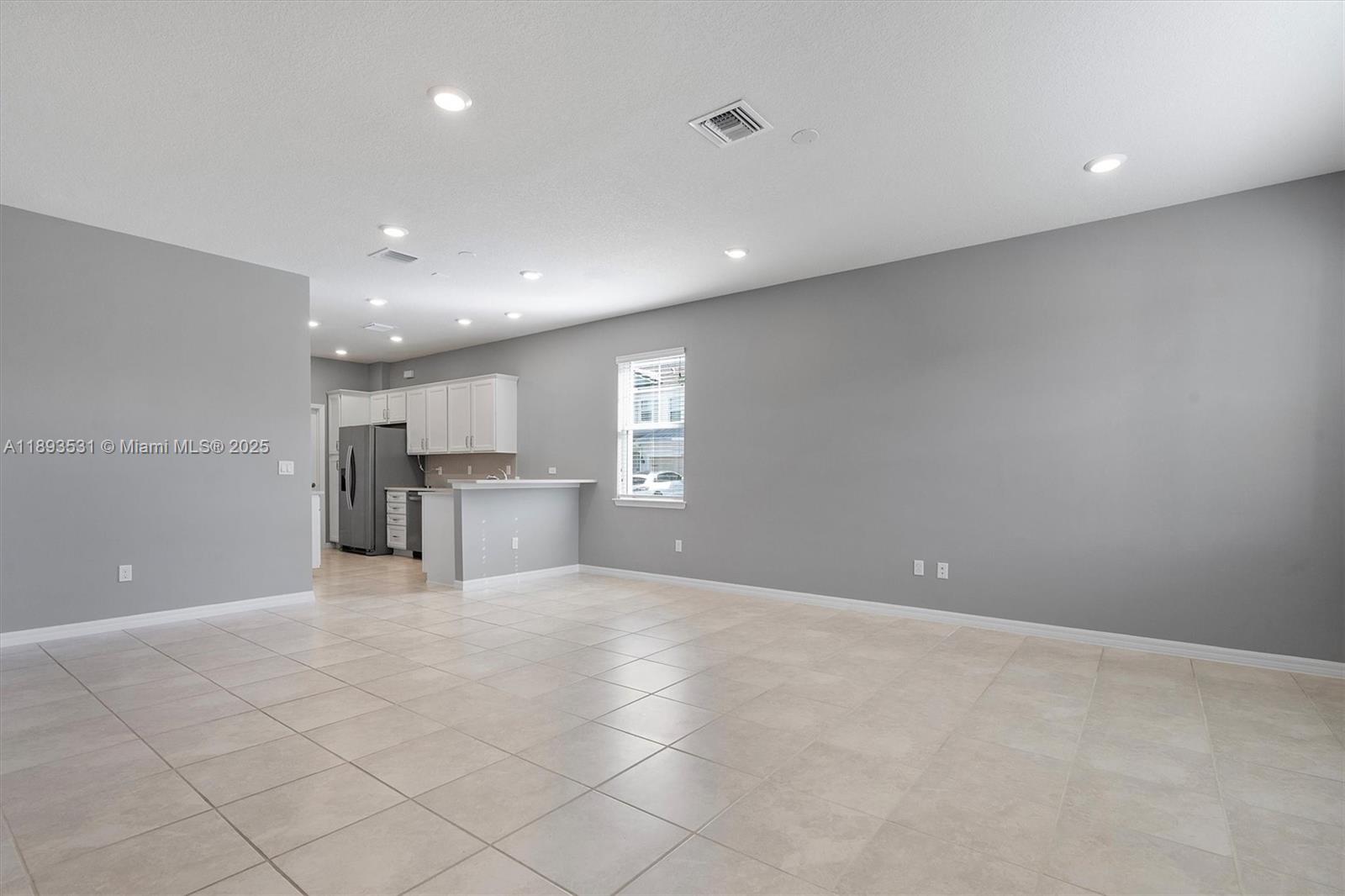 1240 Eucalyptus Drive, Unit 1 Hollywood, FL 33021 - Photo 2 of 20 a view of an empty room with a kitchen