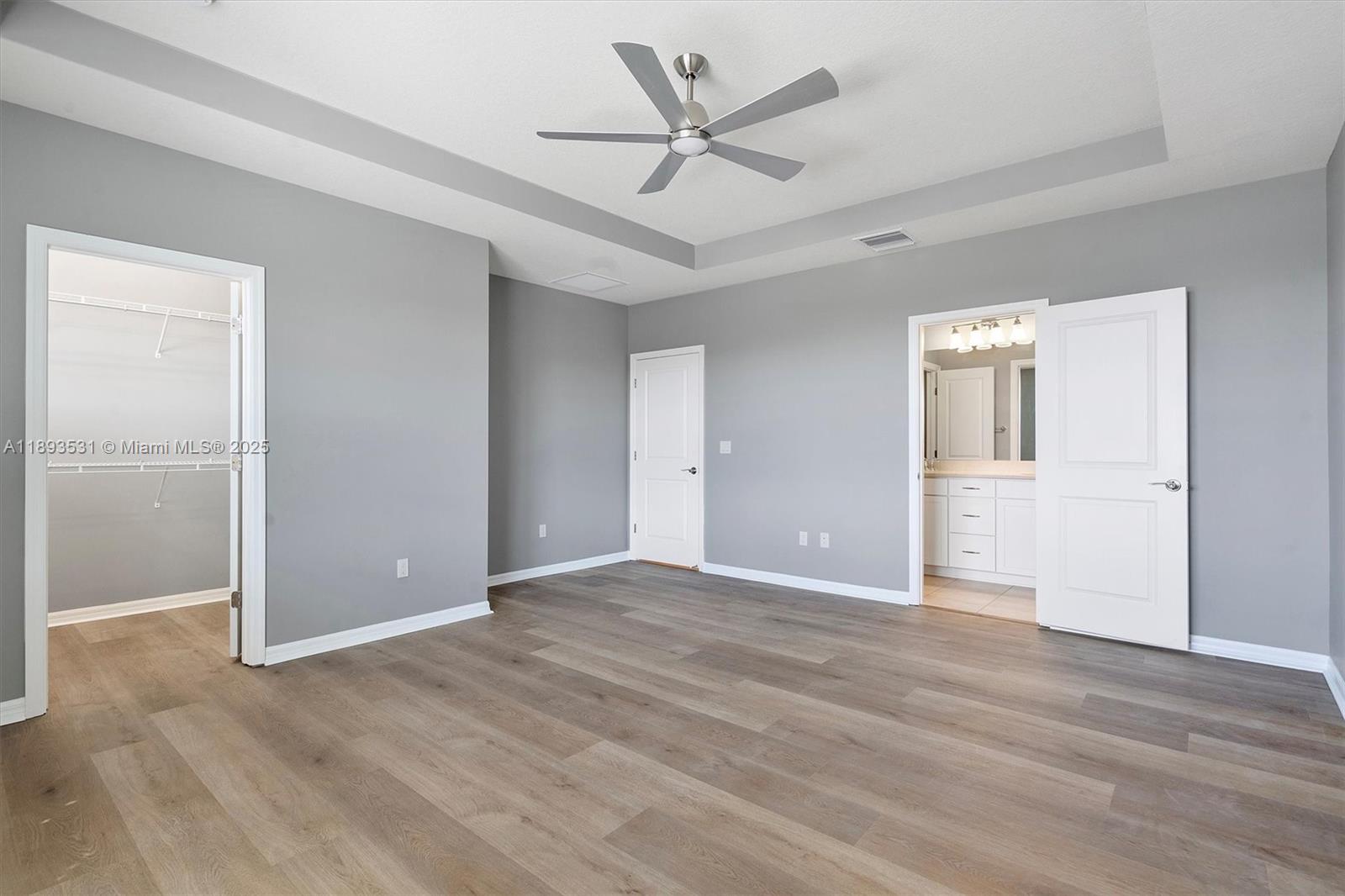 1240 Eucalyptus Drive, Unit 1 Hollywood, FL 33021 - Photo 8 of 20 an empty room with fan and a ceiling fan