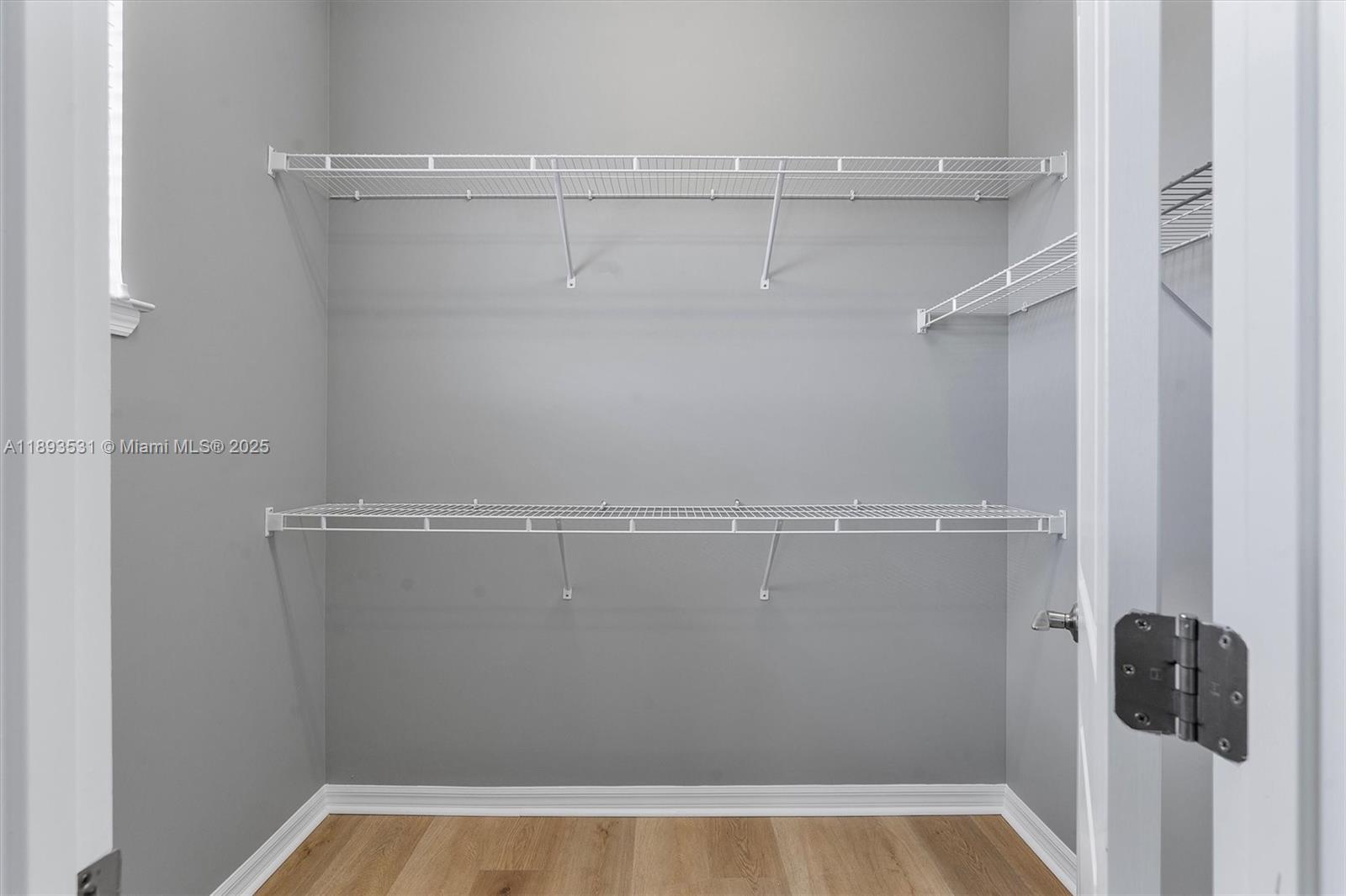 1240 Eucalyptus Drive, Unit 1 Hollywood, FL 33021 - Photo 10 of 20 a view of a room with racks on the wall