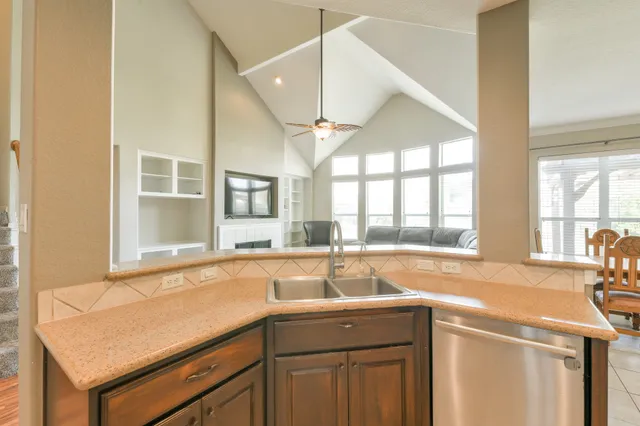 a kitchen with a sink and a window