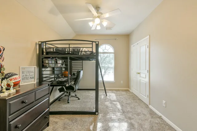a dining room with furniture and a window