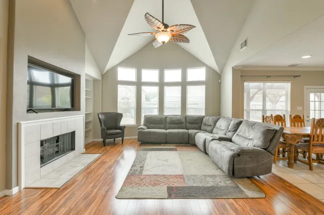 a living room with furniture and a fireplace