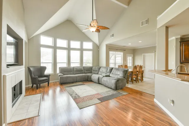a living room with furniture and a large window