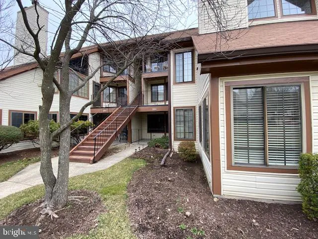 a front view of a house with stairs