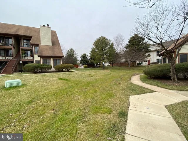 a swimming pool with lots of tress in front of it