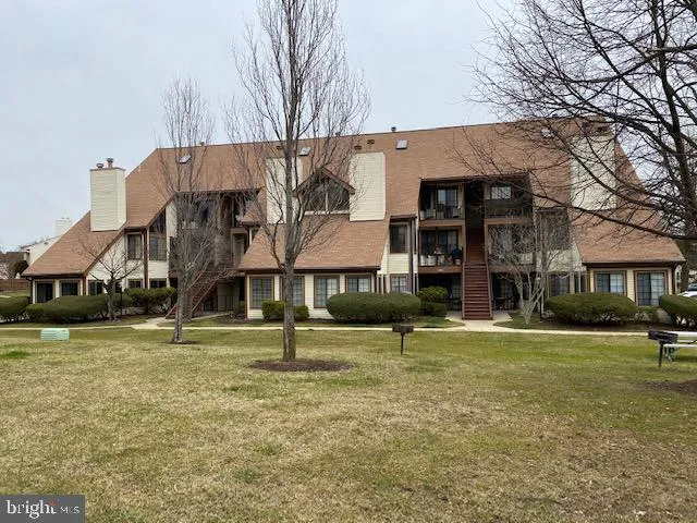 front view of a building with a yard