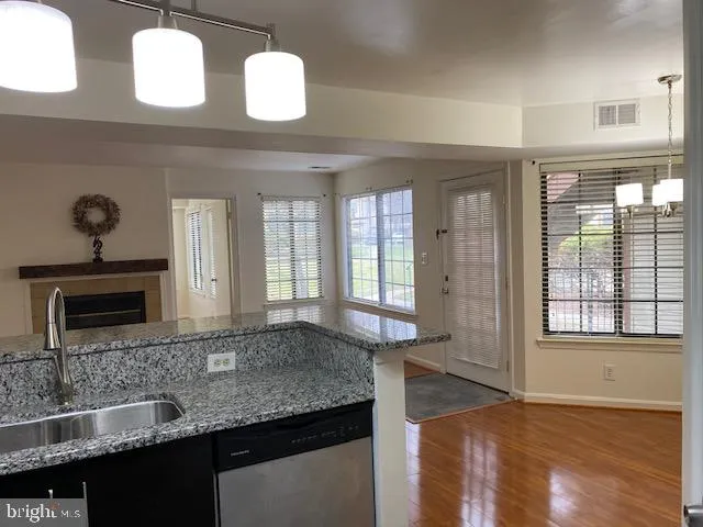 a kitchen with cabinets and window