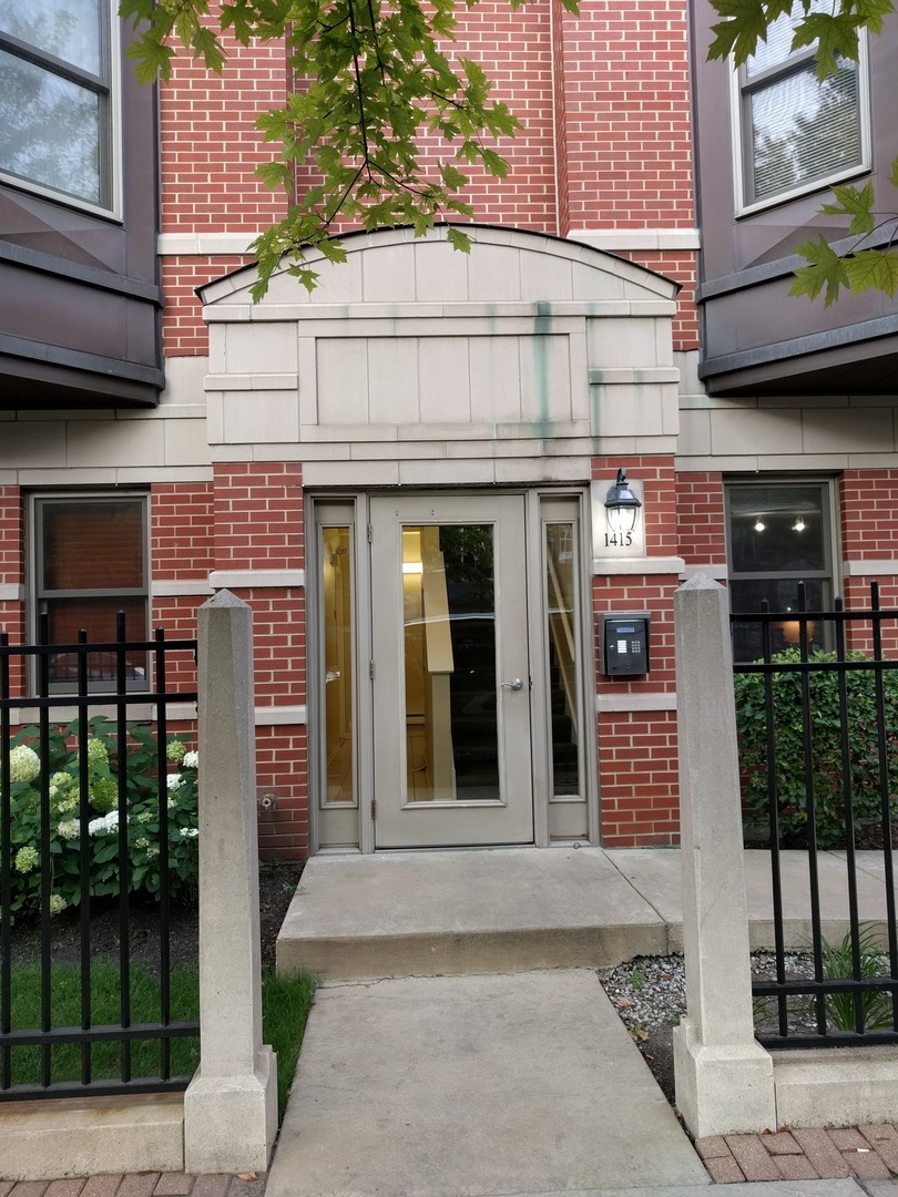 1415 South Halsted Street, Unit 3A Chicago, IL 60607 - Photo 2 of 14 a front view of a building with a street